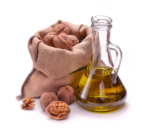 Walnut oil with nuts — Stock Photo, Image