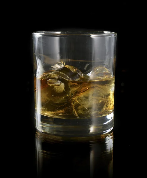 Whiskey with ice in a glass — Stock Photo, Image