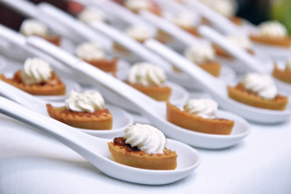 Biscuits with cream and jam — Stock Photo, Image