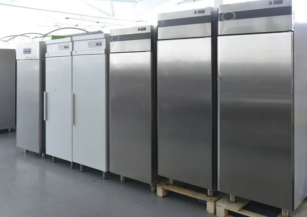 Rows of modern fridges in a store — Stock Photo, Image