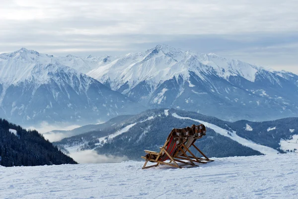 In a chair on a background of mountains — Stock Photo, Image