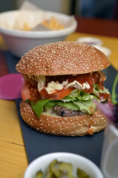 Burger with lettuce leaves — Stock Photo, Image