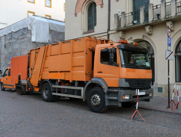 garbage truck in the street cities