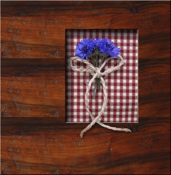 Wooden frame background with blue flowers — Stock Photo, Image