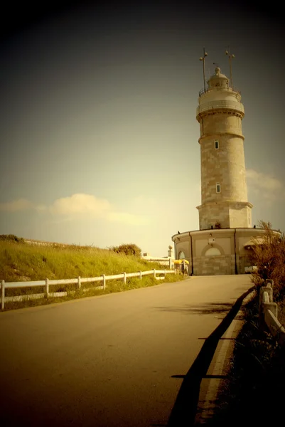 Road and lighthouse — Stock Photo, Image