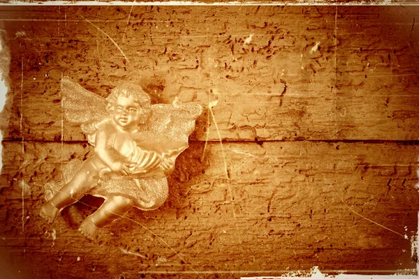 Angel in old wooden background — Stock Photo, Image