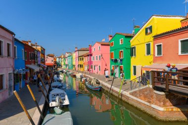 Burano island, Venice, Veneto, Italy. July 25 2022. Editorial stock picture of the streets, alleys and very colorful small houses on the small island of Burano, Venice, Italy. Burano is known for its lace and these multi colored houses. It is a beaut