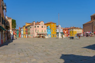 Burano island, Venice, Veneto, Italy. July 25 2022. Editorial stock picture of the streets, alleys and very colorful small houses on the small island of Burano, Venice, Italy. Burano is known for its lace and these multi colored houses. It is a beaut