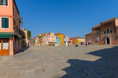Burano island, Venice, Veneto, Italy. July 25 2022. Editorial stock picture of the streets, alleys and very colorful small houses on the small island of Burano, Venice, Italy. Burano is known for its lace and these multi colored houses. It is a beaut