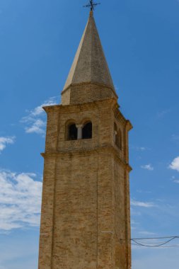 Madonna dellAngelo church, Caorle, Veneto, Italy. July 27, 2022. Editorial stock picture of the Madonna dellAngelo church, Caorle, Italy. The Madonna dellAngelo church is situated at the edge of the sea, and is a big tourist attraction.