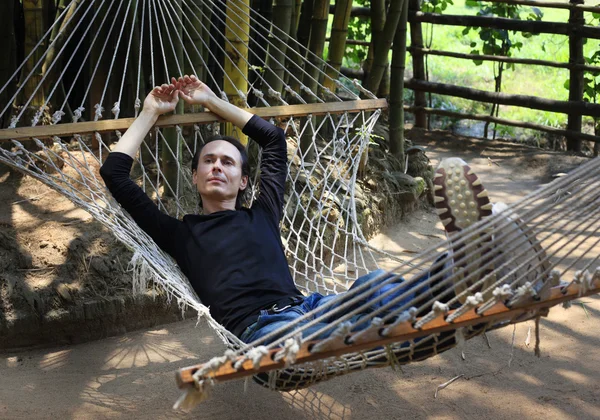 The man in a hammock — Stock Photo, Image