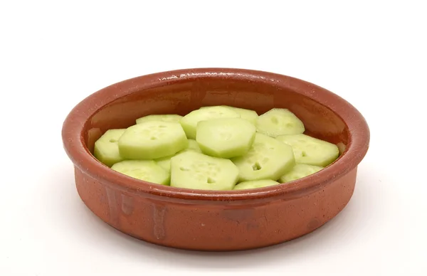 Cucumber slices in bowl of mud — Zdjęcie stockowe