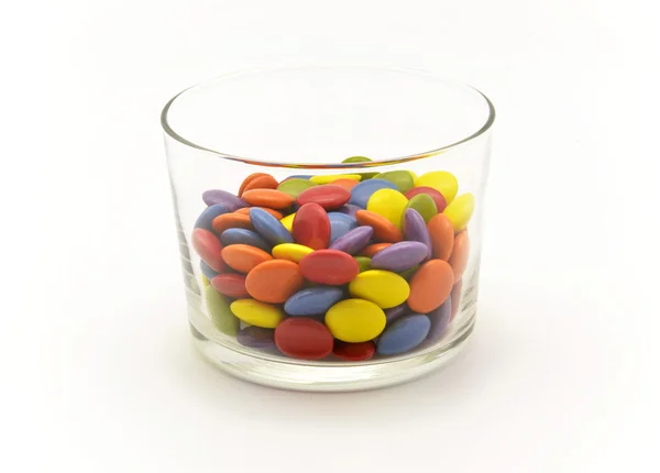 Wielobarwny cukierki czekoladowe w łuk szkło — Zdjęcie stockowe