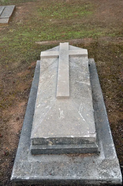 Old stone grave with a cross — Stock Photo, Image