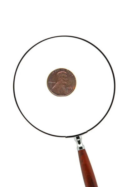 Penny - framsidan med abraham lincoln bakom ett förstoringsglas — Stockfoto