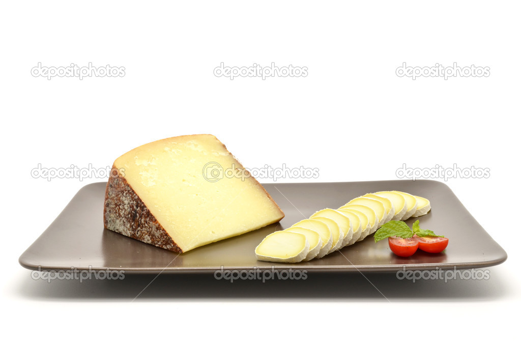 Pecorino di Pienza, typical italian sheep cheese and sliced camembert