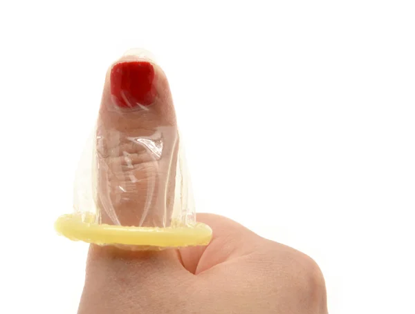 Hand with condom isolated on white — Stock Photo, Image