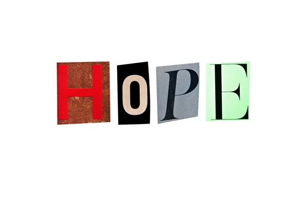 Η λέξη ελπίδα σχηματίζεται με το περιοδικό γράμματα σε λευκό φόντο — Φωτογραφία Αρχείου