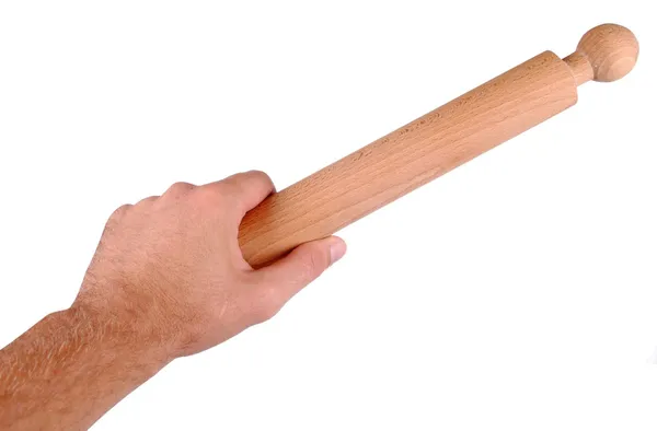 Mano sostiene un rodillo de madera, aislado en blanco — Foto de Stock