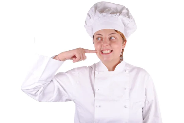Young female executive chef point her cheek, isolated on white — Stock Photo, Image