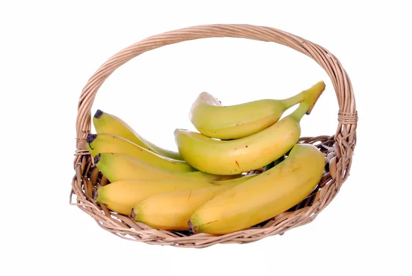 Bananas in a straw basket — Stock Photo, Image