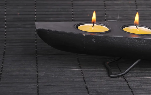 Orange candles on a black dish — Stock Photo, Image
