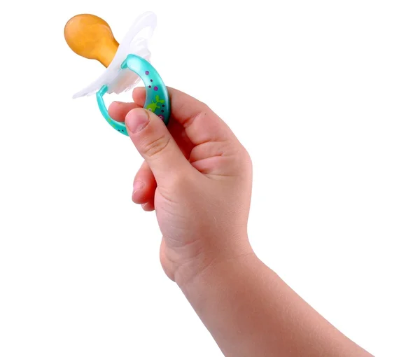 Kid hand with a baby dummy, isolated on white — Stock Photo, Image