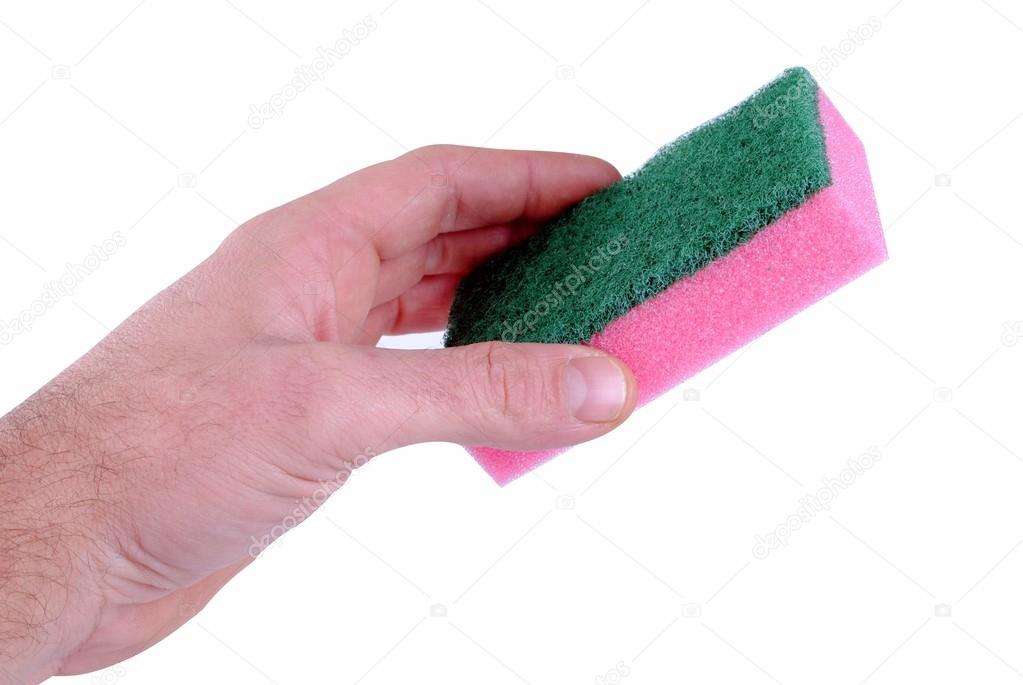 Man hand holds a sponge isolated on white background