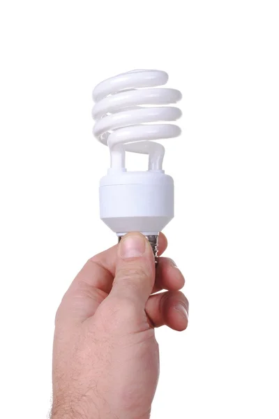 Man hand houdt een energie spaarder lamp, geïsoleerd op witte achtergrond — Stockfoto