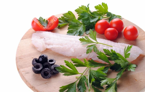 Cod steak with tomatoes olives and parsley isolated — Stock Photo, Image