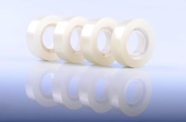 Transparent scotch tape rolls in a row — Stock Photo, Image