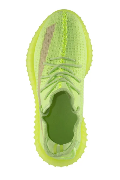 白色背景上的绿色抹布运动鞋顶视图 — 图库照片