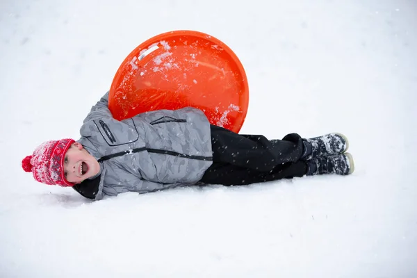 Cute Young Boy Smiling While Sledding — Stock Photo, Image