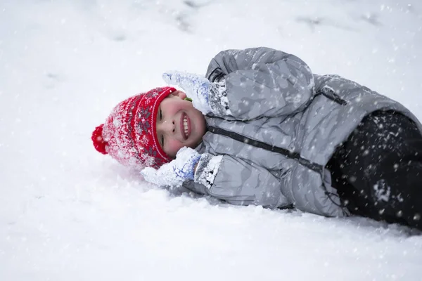 Boy Lies Snow Winter Laughs — Stockfoto