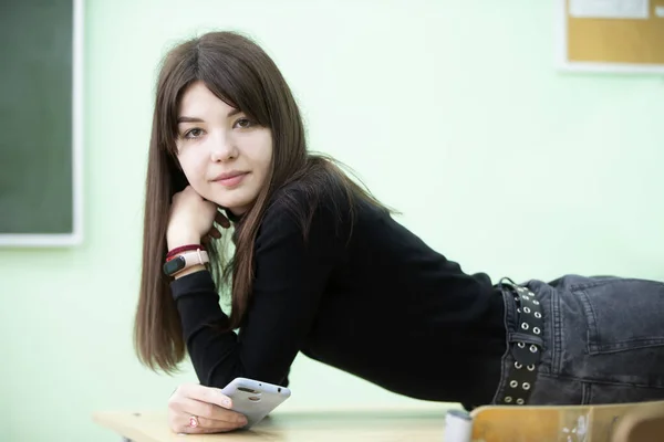 Teenage Girl Lies School Desk Looks Camera High School Student — Stockfoto