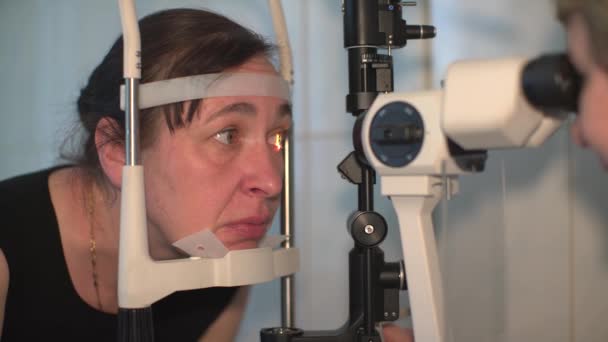 Female Optometrist Examining Vision Another Woman Slit Lamp — Stock Video