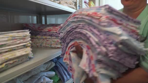 Nurse Folds Hospital Linen — Wideo stockowe