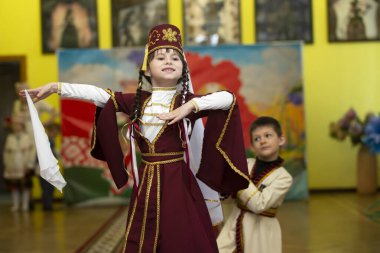  A boy and a girl in national Georgian clothes.