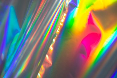 Rainbow holographic bokeh background. Multicolored overflows of color.