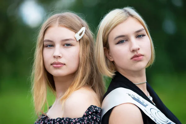 Close Portrait Two Beautiful Girls Sisters — стоковое фото