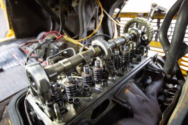 Mercedes diesel engine repair. Hands with a mechanic repairing Mercedes parts. The gas distribution mechanism of the car.