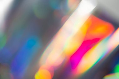 Gökkuşağı holografik bokeh arka planı. Renklerin çok renkli taşması.