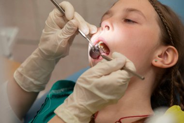 The child is being treated for teeth in the dental office.Child in the dentist office