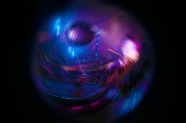 Twisted blue ball on a black background.