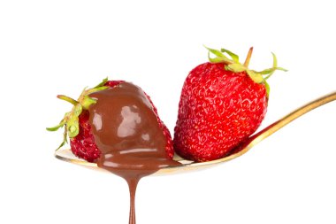 Strawberries on golden spoon with chocolate dipping isolated on white. Chocolate dripping from strawberries. Beautiful red berry. Sweet dessert.