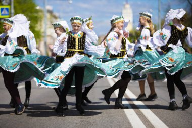 Belarus, Gomil, May 09, 2021 Holiday in the city. Beautiful young Slavic girls in ethnic costumes.