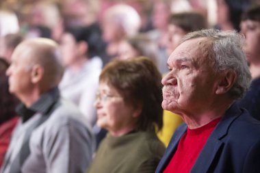 Belarus, city of Gomil, April 01, 2022. Elderly spectators stand in the auditorium.