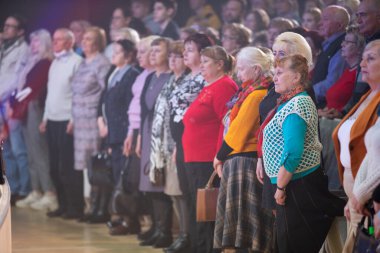 Belarus, city of Gomil, April 01, 2022. Elderly spectators stand in the auditorium.