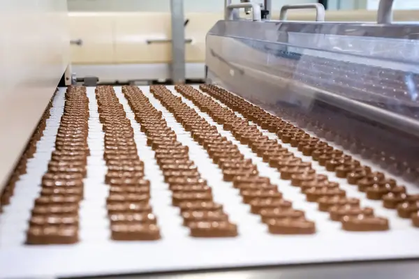 The production of chocolate bars. The confectionery factory. The concept: suspension of production, sanctions, business closure, leaving Russia, import substitution, nationalization.