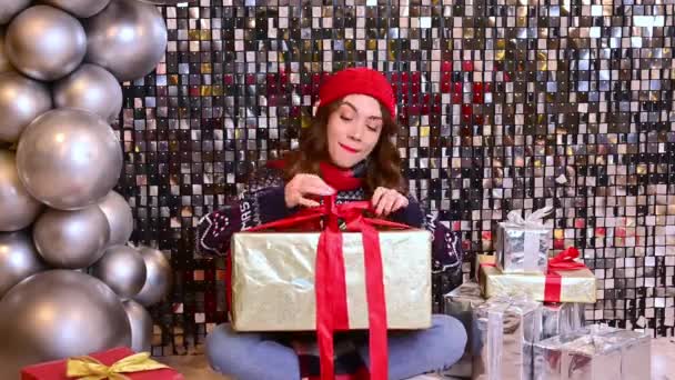 Beautiful Woman Red Hat Scarf Big Gift Sits Floor Dances — Stock Video